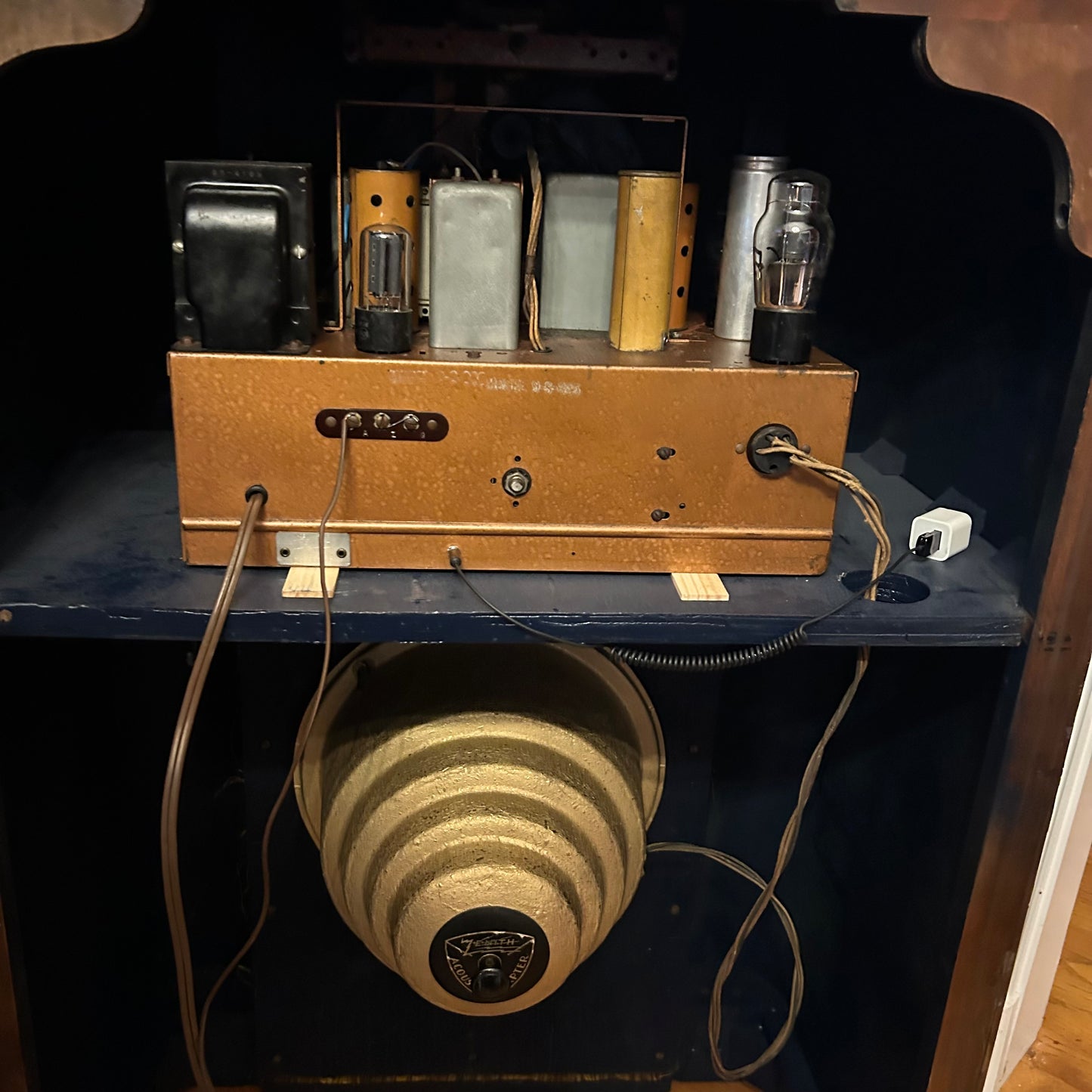 Vintage electronic device with vacuum tubes on a dark surface