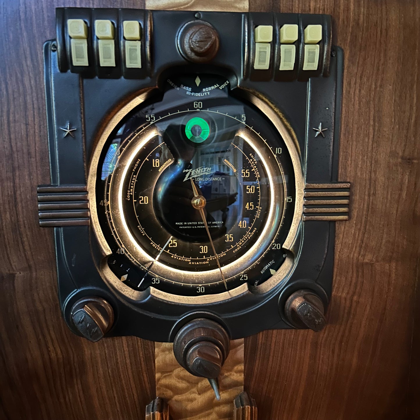 Vintage-style instrument with dials and buttons on a wooden background