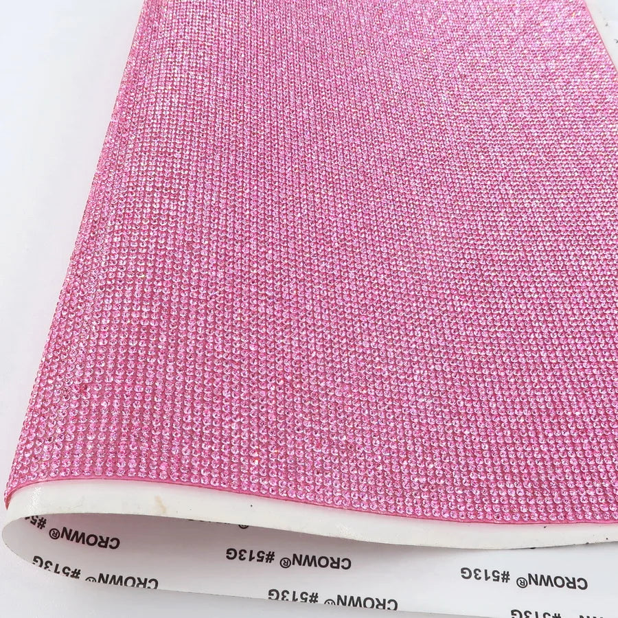 Vibrant adhesive speaker wrap with a sleek design, featuring a decorative glass rhinestone trim for a stylish and elegant touch.
