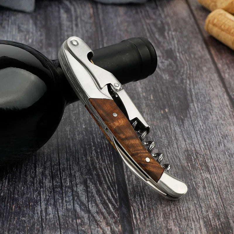 Corkscrew with wooden handle on a dark wooden surface