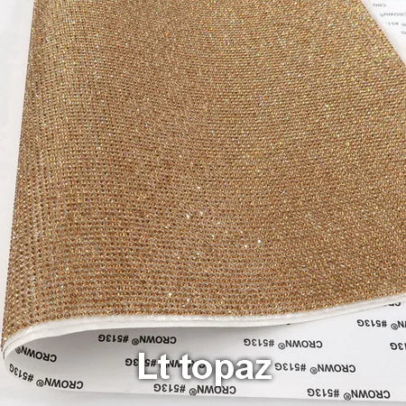 Vibrant adhesive speaker wrap with a sleek design, featuring a decorative glass rhinestone trim for a stylish and elegant touch.