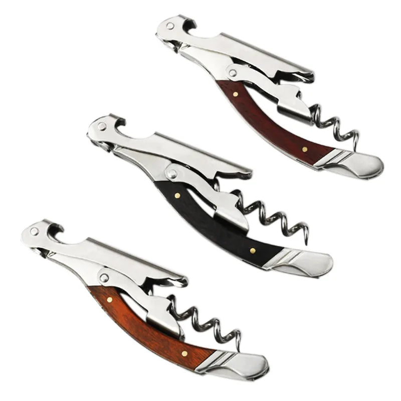 Three corkscrews with wooden handles on a white background