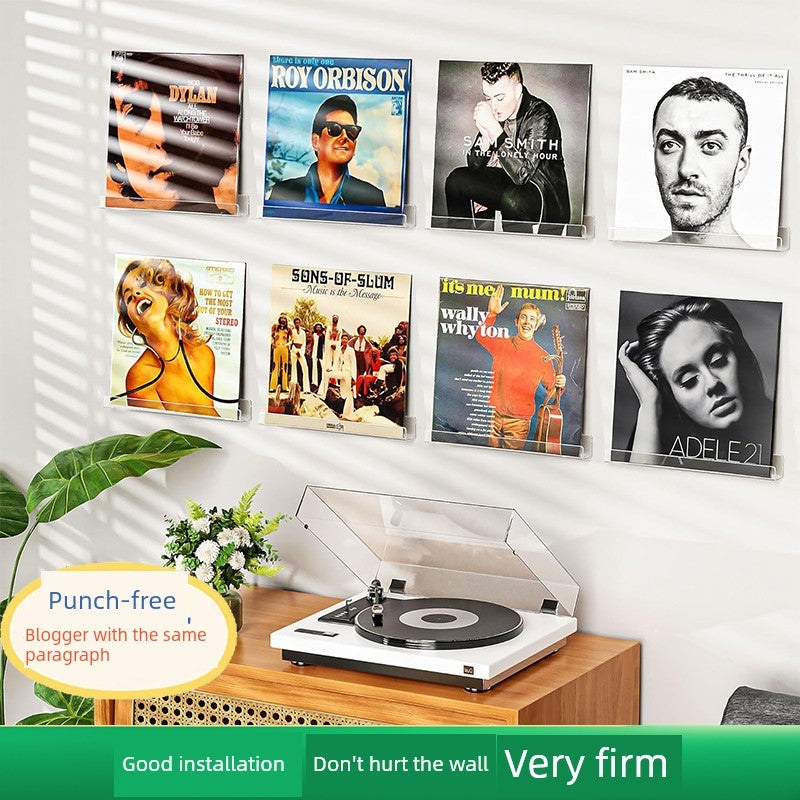 Clear plastic vinyl record display shelf, designed for wall-mounted storage and showcasing LPs, 12-inch, and 7-inch records in a sleek, modern style.