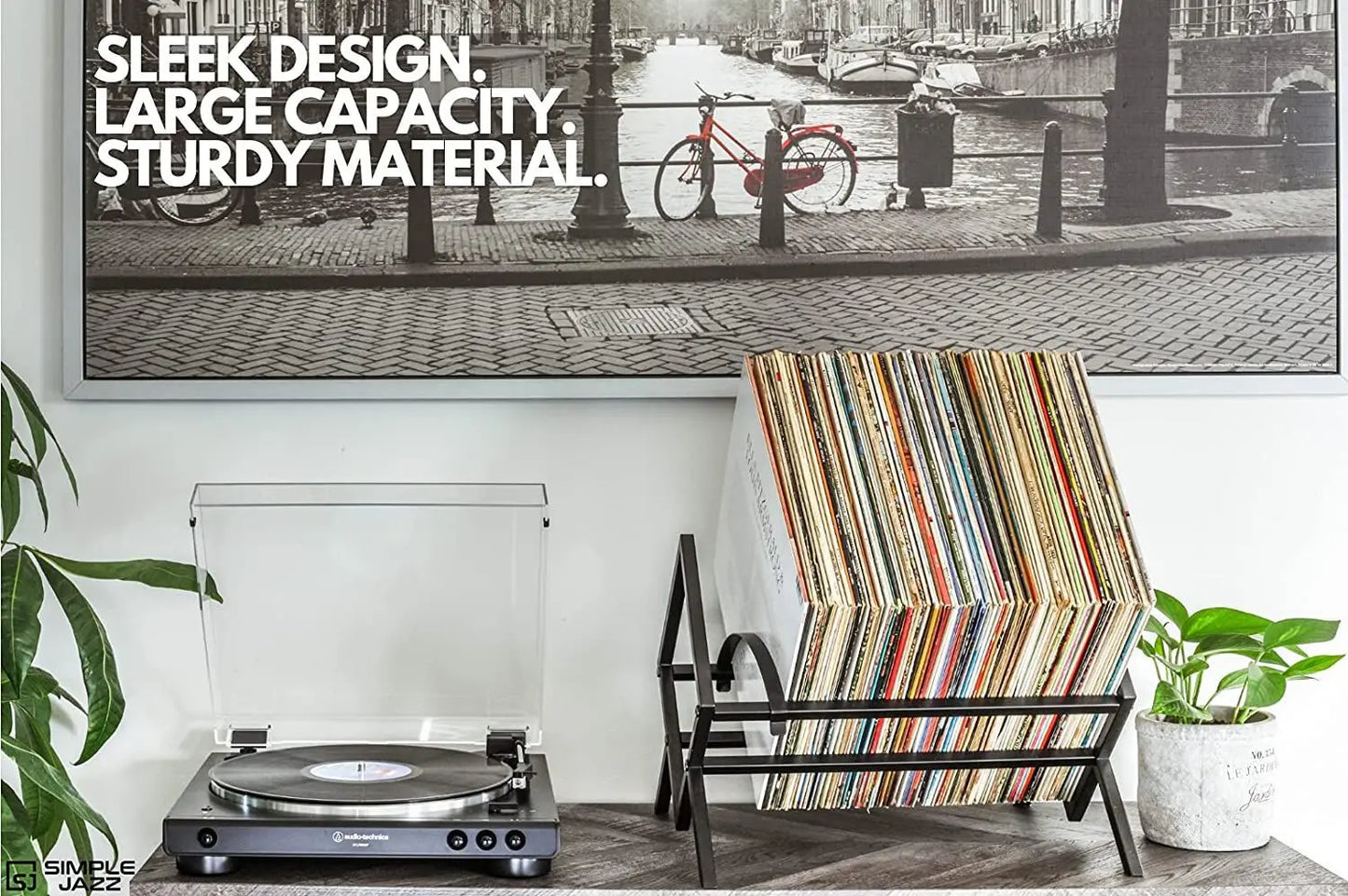 Modern steel vinyl record stand with angled frame and open storage design, holds up to 100 LPs, durable metal construction for easy album browsing and display