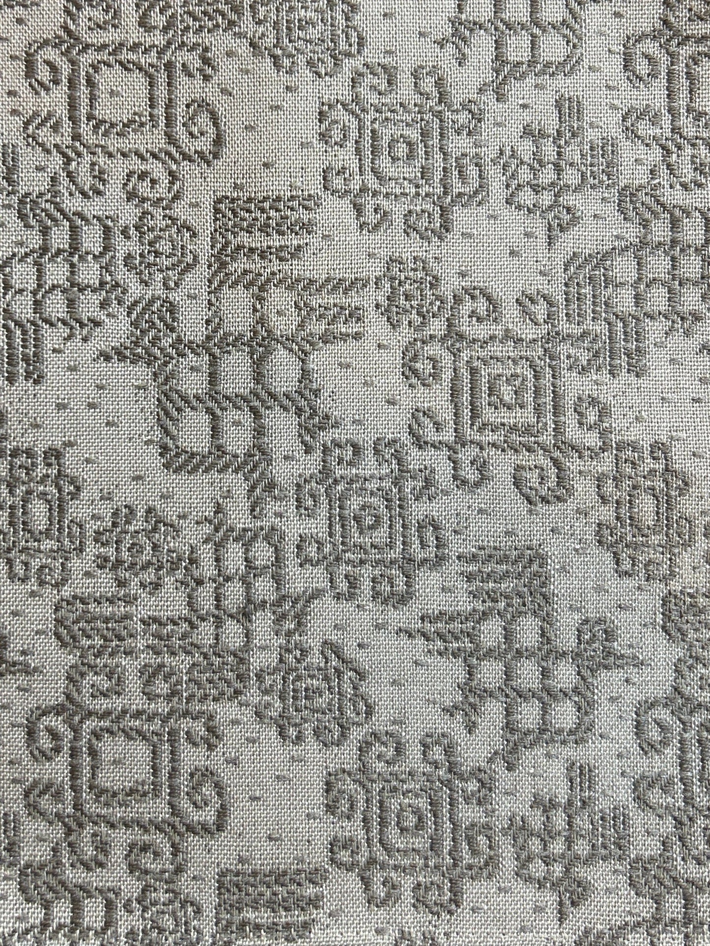 Intricate tan vintage speaker grill cloth with Aztec-inspired geometric patterns, ideal for Native American folk art décor and upholstery.