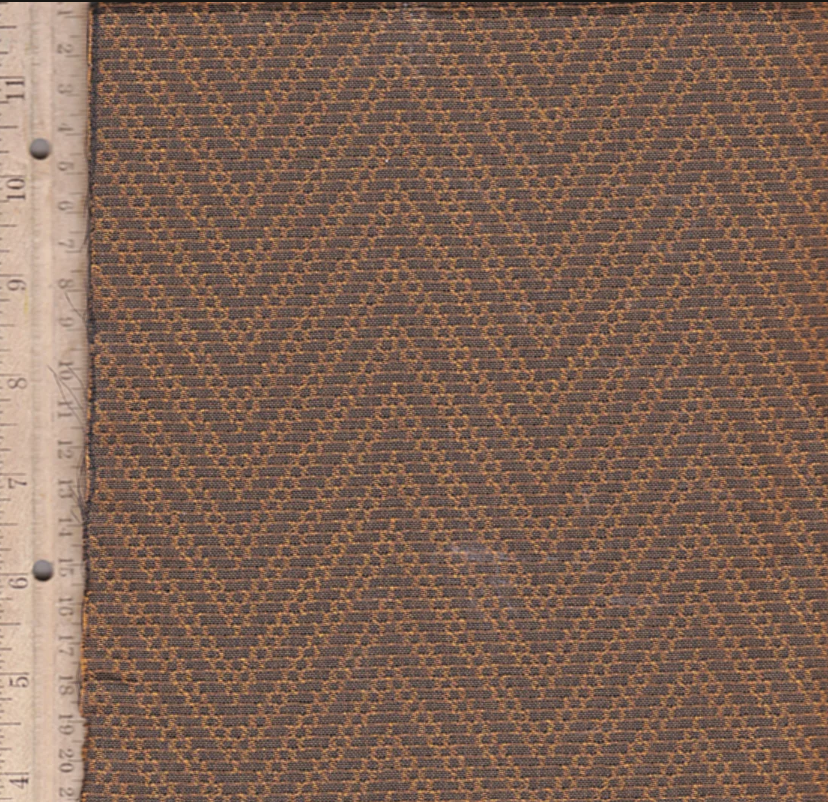 Antique radio grill cloth in warm brown and golden chevron pattern, ideal for restoring 1930s console radios and enhancing retro stereo setups.