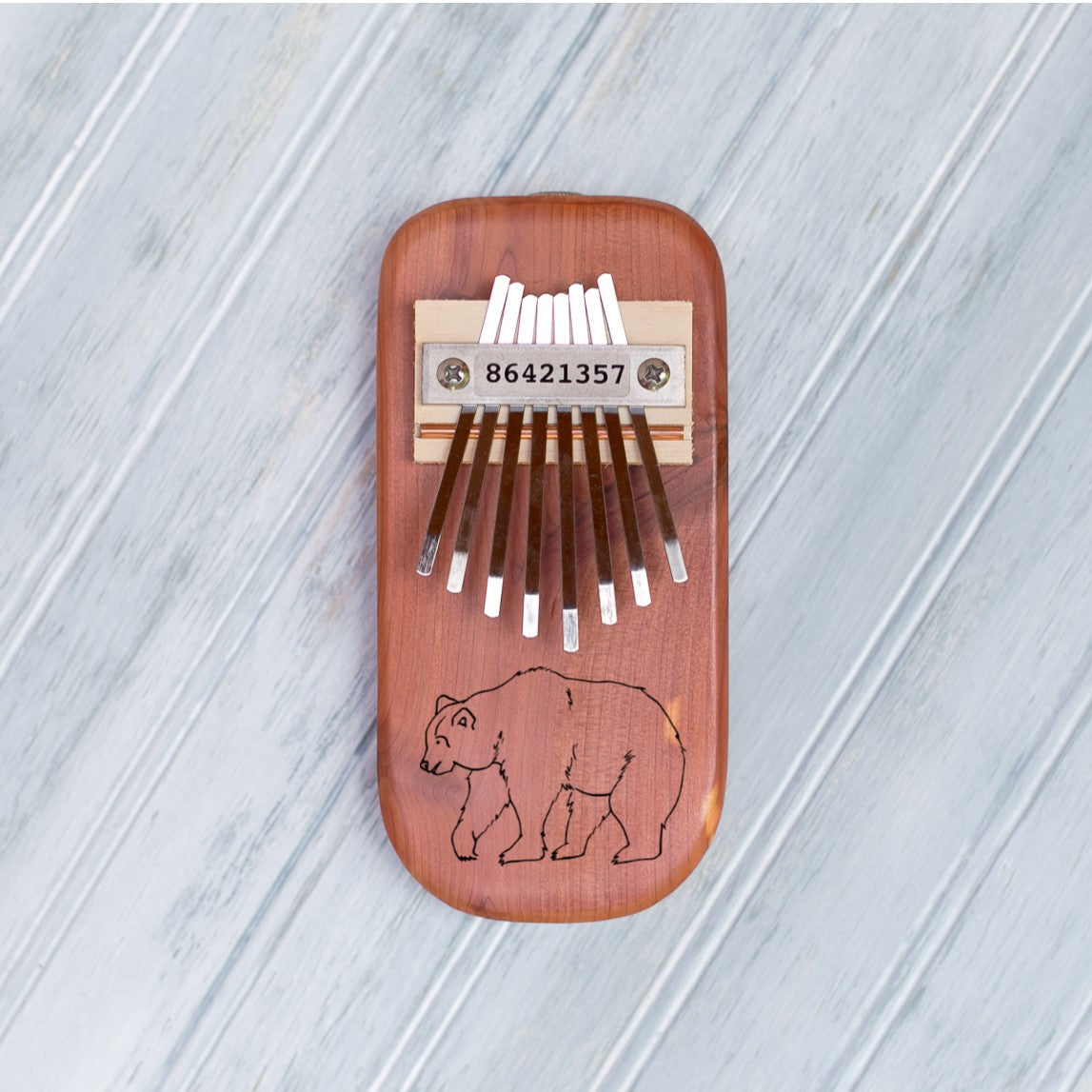 Bear Engraved Thumb Piano