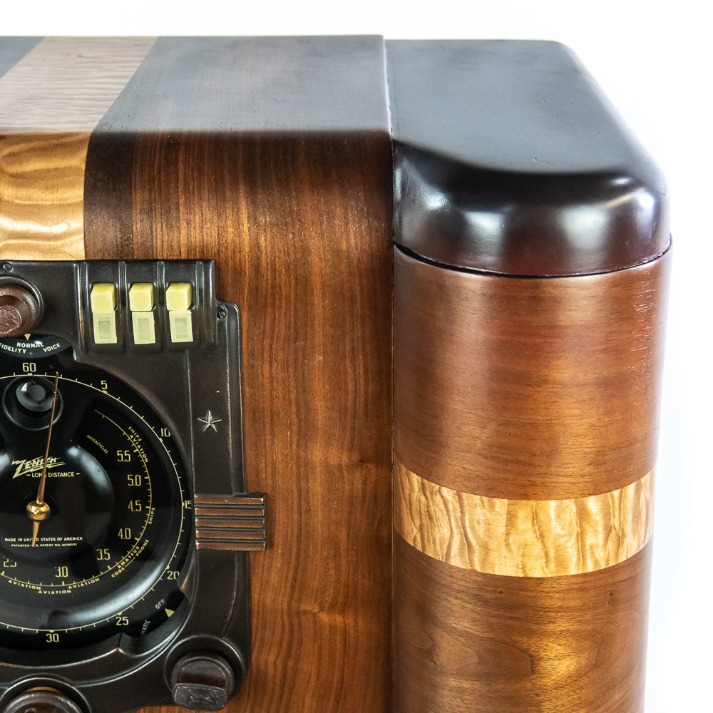 Close-up of a vintage wooden radio with a focus on the dial and wood grain.