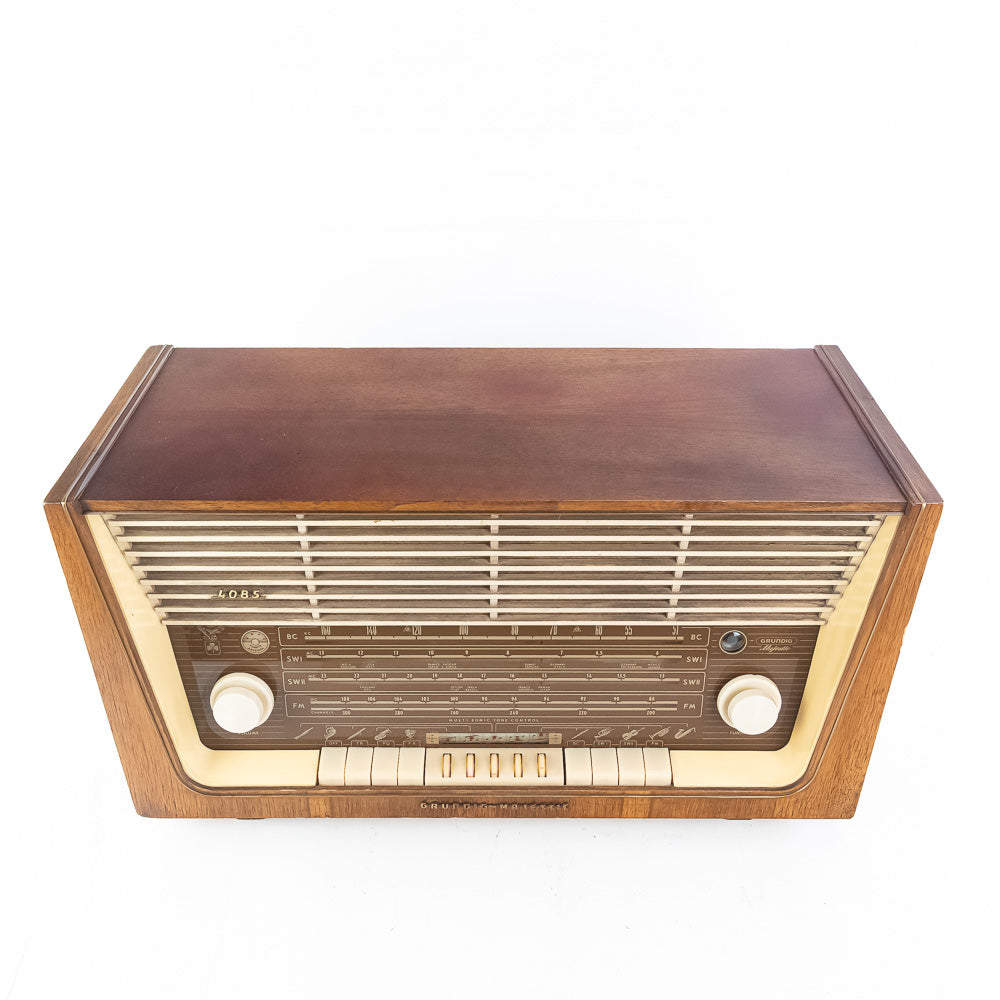 Vintage-style radio with wooden casing on a white background