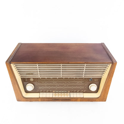 Vintage-style radio with wooden casing on a white background
