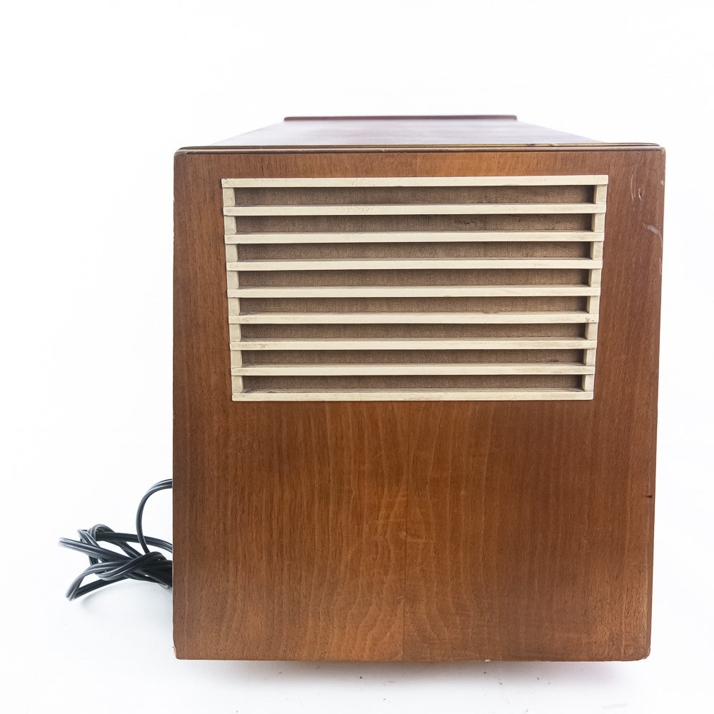 Wooden speaker with a grid design on a white background