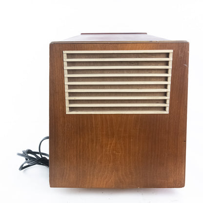 Wooden speaker with a grid design on a white background