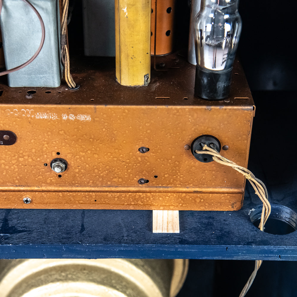 Close-up of an old electronic device with visible wiring and components.