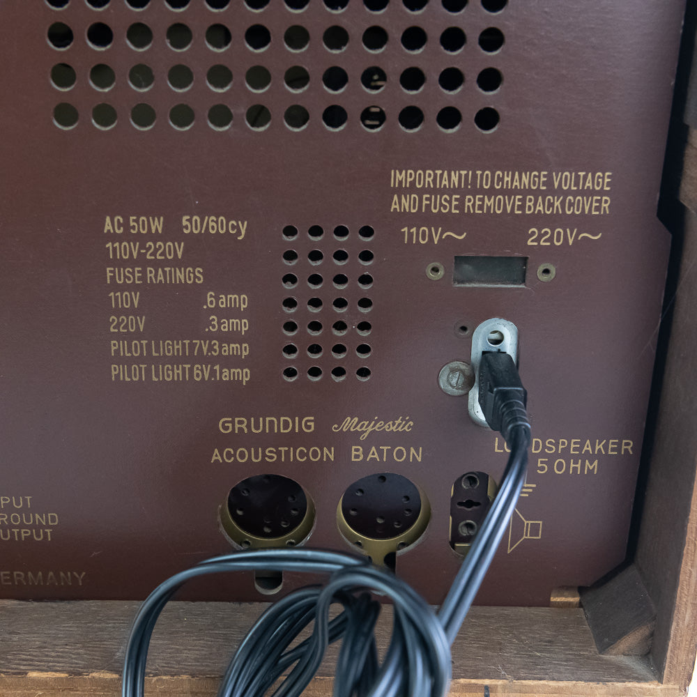 Back of a vintage Grundig loudspeaker with wiring and technical details.