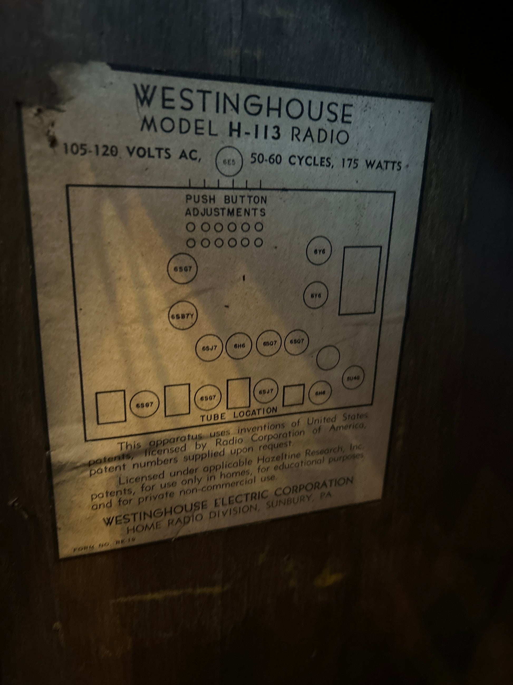 Vintage Westinghouse radio model H-113 manual on a dark surface