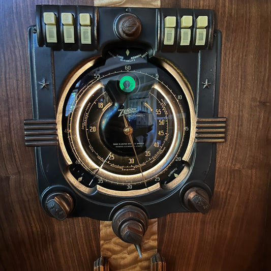 Vintage-style instrument with dials and buttons on a wooden background