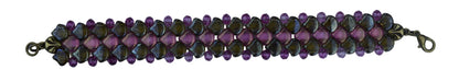 Bracelet with pink and brown beads on a light gray background