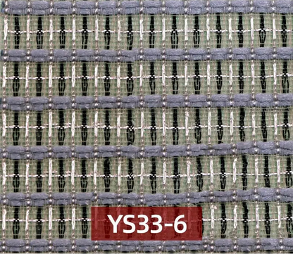 A close-up of a woven fabric texture with horizontal stripes in gray, sage green, black, and white,