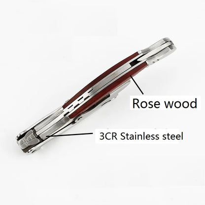 Tie clip with rose wood and 3CR stainless steel components on a white background