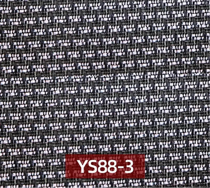 A close-up of a woven fabric texture with a black and white pattern, f