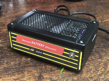 Antique radio battery eliminator powering a restored vintage tube radio for steady, clean sound—perfect battery replacement power supply for collectors and restorers